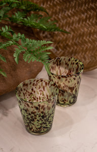 Clear, brown and green decorative drinking glass