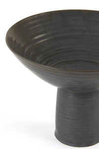 Black ceramic dish on base