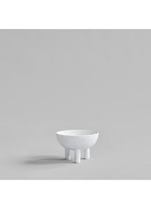 White bowl on legs